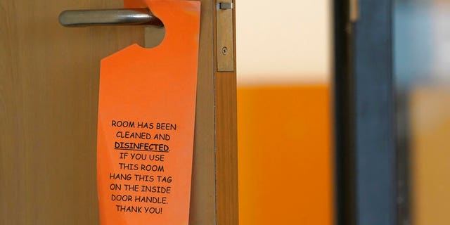 A sign that indicates a room has been disinfected hangs in a fourth-grade classroom, Tuesday, Feb. 2, 2021, at Elk Ridge Elementary School in Buckley, Wash.?