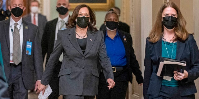 Vice President Kamala Harris arrives to hold mock swearing-in ceremonies for Senators in the Old Senate Chamber at the U.S. Capitol in Washington, Thursday, Feb. 4, 2021. (AP Photo/Andrew Harnik)