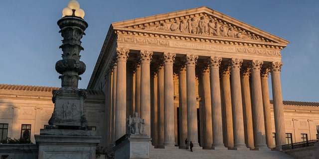 In this Friday, Nov. 6, 2020 file photo, The Supreme Court is seen at sundown in Washington.