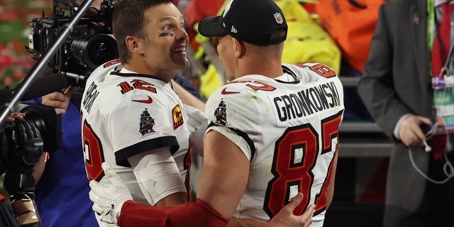 Tampa Bay Buccaneers quarterback Tom Brady (12) and Rob Gronkowski (87) celebrate their win in the NFL Super Bowl 55 football game against the Kansas City Chiefs Sunday, Feb. 7, 2021, in Tampa, Fla. The Buccaneers defeated the Chiefs 31-9 to win the Super Bowl.