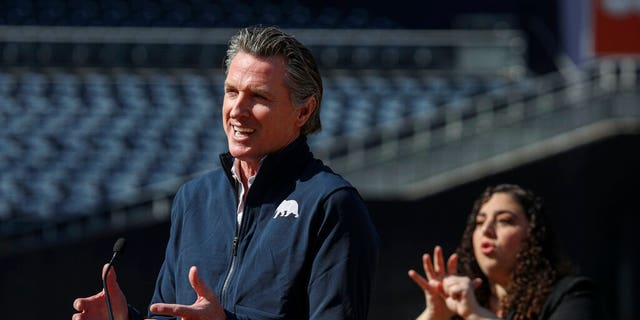 California Governor Gavin Newsom speaks at a press conference at Petco Park, which will host a vaccination site in a parking lot next to the baseball stadium as part of a San Diego County partnership , the San Diego Padres baseball team and UC San Diego Health, Monday, February 8, 2021, in San Diego. 