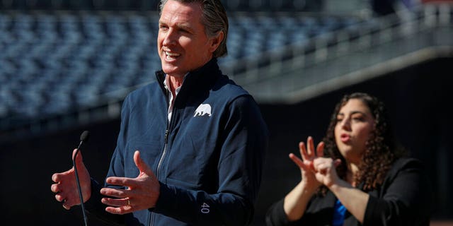 California Governor Gavin Newsom speaks at a press conference at Petco Park, which will host a vaccination site in a parking lot next to the baseball stadium as part of a San Diego County partnership , the San Diego Padres baseball team and UC San Diego Health, Monday, February 8, 2021, in San Diego. 