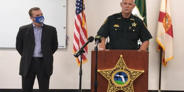 In this screen shot from a YouTube video posted by the Pinellas County Sheriff's Office, Pinellas County Sheriff Bob Gualtieri speaks during a news conference as Oldsmar, Fla., Mayor Eric Seidel, left, listens, Monday, Feb. 8, 2021, in Oldsmar, Fla. (Pinellas County Sheriff's Office via AP)
