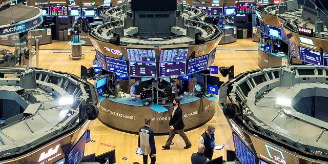 In this photo provided by the New York Stock Exchange, traders work on the floor, Tuesday, Feb. 9, 2021. (Courtney Crow/New York Stock Exchange via AP)