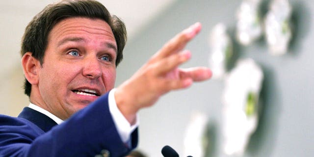 FILE: Florida Gov. Ron DeSantis answers questions during a press conference on the expanded rollout of the Moderna COVID-19 vaccine, at Orlando Health South Seminole Hospital in Longwood, Fla. 