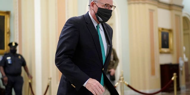 Sen. Richard Burr, R-N.C., walks in the Capitol as the Senate proceeds in a rare weekend session for final arguments in the second impeachment trial of former President Donald Trump, at the Capitol in Washington, Saturday, Feb. 13, 2021. (AP Photo/J. Scott Applewhite)