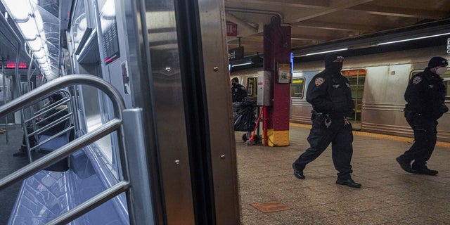 Police patrol the Line A subway bound for Inwood, after the NYPD deployed an additional 500 officers to the subway system following deadly attacks on Saturday, February 13, 2021, in New York City.  (AP Photo / Bebeto Matthews)