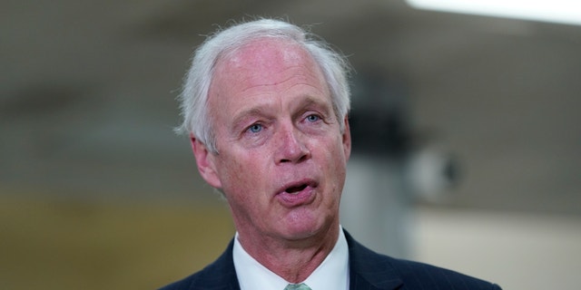 Sen. Ron Johnson, R-Wis., talks to reporters on Capitol Hill in Washington, Friday, Feb. 12, 2021. (AP Photo/Susan Walsh, file)