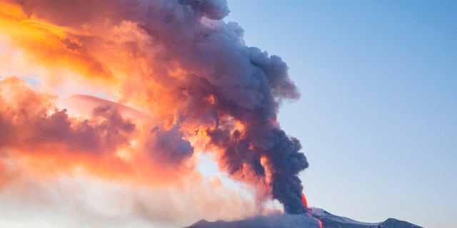 Lava gushes from the Mt Etna volcano near Catania, Sicily, Tuesday, Feb. 16, 2021. Europe's most active volcano came alive around 4 pm local time on Tuesday, according to the Italian Institute of Geophysics and Volcanology. (AP Photo/Salvatore Allegra)