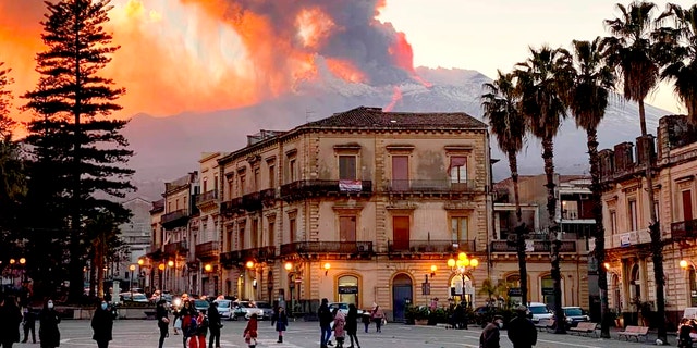 Mount Etna, Europe’s most active volcano, spews ash and lava, as seen from Catania, southern Italy, Tuesday, Feb. 16, 2021. Mount Etna in Sicily, southern Italy, has roared back into spectacular volcanic action, sending up plumes of ash and spewing lava. (Davide Anastasi/LaPresse via AP)