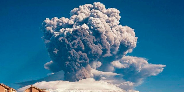 Smoke billows from Mount Etna, Europe’s most active volcano, Tuesday, Feb. 16, 2021. Mount Etna in Sicily, southern Italy, has roared back into spectacular volcanic action, sending up plumes of ash and spewing lava. (Davide Anastasi/LaPresse via AP)