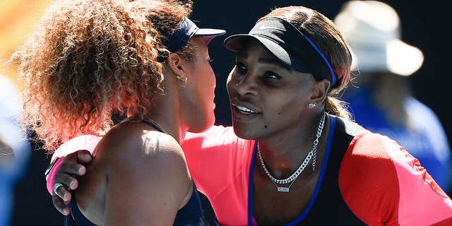 Japan's Naomi Osaka, left, is congratulated by United States' Serena Williams after winning their semifinal match at the Australian Open tennis championship in Melbourne, Australia, Thursday, Feb. 18, 2021.(AP Photo/Andy Brownbill)