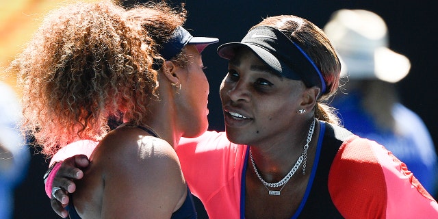 Japan's Naomi Osaka, left, is congratulated by United States' Serena Williams after winning their semifinal match at the Australian Open tennis championship in Melbourne, Australia, Thursday, Feb. 18, 2021.(AP Photo/Andy Brownbill)
