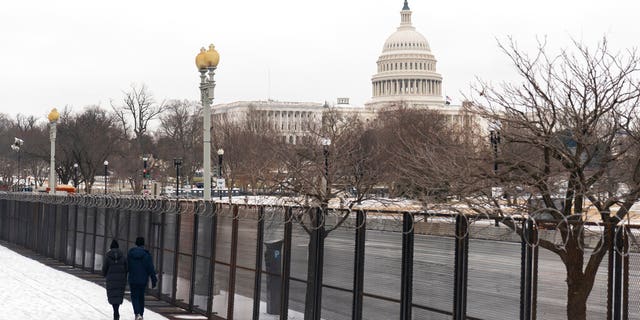 The U.S. Capitol is seen behind the metal security fencing around the U.S. Capitol, Thursday, Feb. 18, 2021. (AP Photo/Manuel Balce Ceneta)