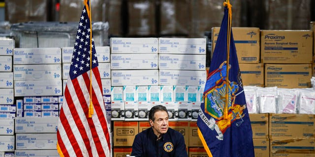 FILE: Gov. Andrew Cuomo speaks during a news conference against a backdrop of medical supplies at the Jacob Javits Center that will house a temporary hospital in response to the COVID-19 outbreak in New York.