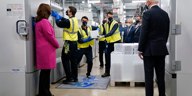 President Joe Biden, right, and Michigan Gov. Gretchen Whitmer, left, tour a Pfizer manufacturing site in Portage, Mich on Feb. 19, 2021. (AP Photo/Evan Vucci, File)