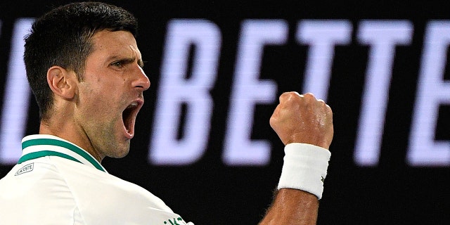 Serbia's Novak Djokovic reacts after winning a point against Russia's Daniil Medvedev in the men's singles final at the Australian Open tennis championship in Melbourne, Australia, Sunday, Feb. 21, 2021.(Associated Press)