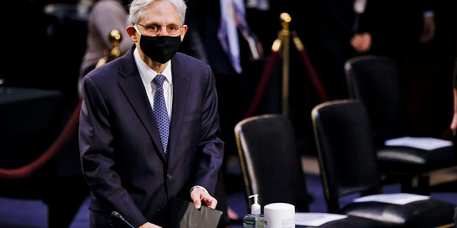 Judge Merrick Garland arrives to testify before a Senate Judiciary Committee hearing on his nomination to be U.S. Attorney General, Monday, Feb. 22, 2021 on Capitol Hill in Washington. (Carlos Barria/Pool via AP)