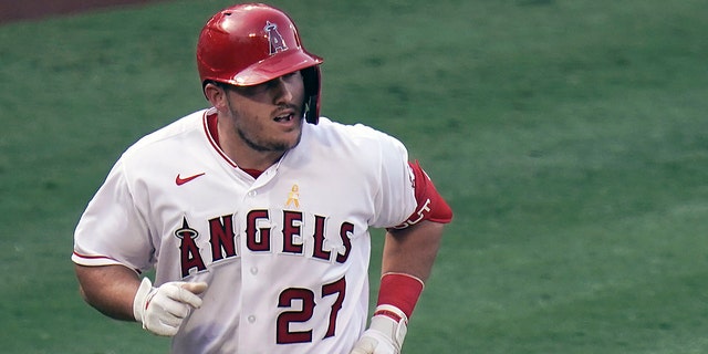 Los Angeles Angels' Mike Trout rounds the bases after hitting a two-run home run during the third inning of the first baseball game of a doubleheader against the Houston Astros in Anaheim, California, in this Saturday, Sept. 5, 2020, file photo. (WHD Photo/Jae C. Hong, File)