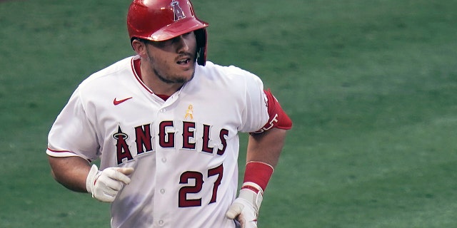 Los Angeles Angels' Mike Trout rounds the bases after hitting a two-run home run during the third inning of the first baseball game of a doubleheader against the Houston Astros in Anaheim, California, in this Saturday, Sept. 5, 2020, file photo. (WHD Photo/Jae C. Hong, File)