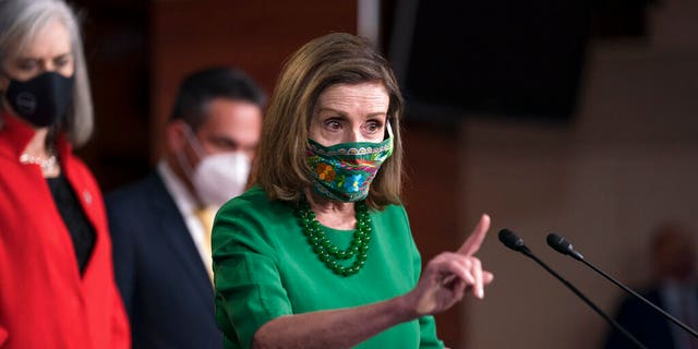 Speaker of the House Nancy Pelosi, D-Calif., meets with reporters before the House votes to pass a $1.9 trillion pandemic relief package, during a news conference at the Capitol in Washington, Friday, Feb. 26, 2021. 