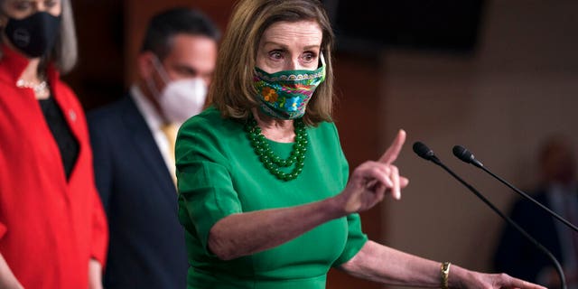 Speaker of the House Nancy Pelosi, D-Calif., meets with reporters before the House votes to pass a $1.9 trillion pandemic relief package, during a news conference at the Capitol in Washington, Friday, Feb. 26, 2021.