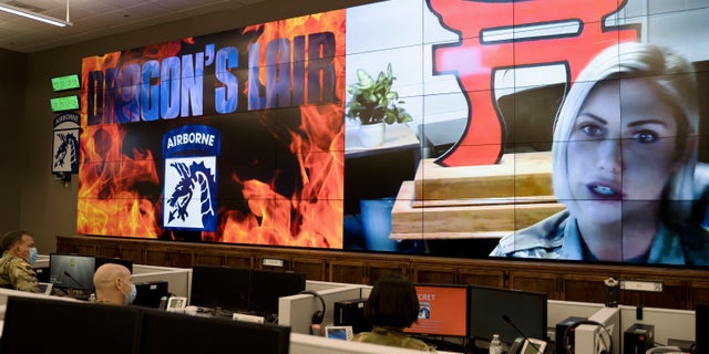 In this Monda, Feb. 22, 2021, photo released by the U.S. Army, Sgt. Taylor Knueven pitches an idea to better the U.S. Army's Sexual Harassment and Assault and Prevention Program to a panel at Fort Bragg, N.C. Knueven shared her own story of assault during the "Dragon's Lair" panel. The 18th Airborne Corps says it plans to implement parts of all seven pitches heard at the presentation. (Sgt. Marygian D. Barnes/U.S. Army via AP)