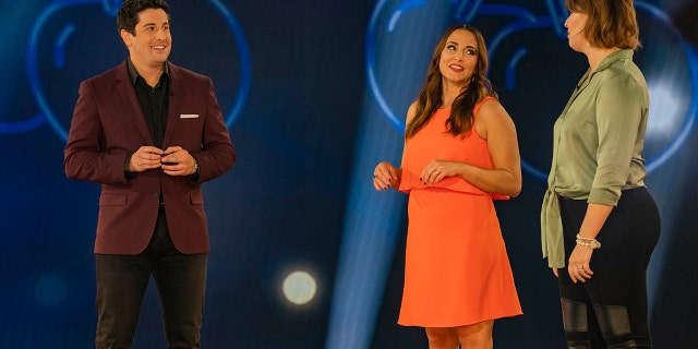 L-R: Host Jason Biggs with contestants Cara and Gwen in an episode of "Cherries Wild.'