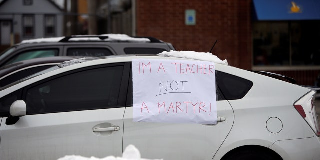 Supporters of the Chicago Teachers Union participate in a car caravan, as negotiations with Chicago Public Schools continue over a coronavirus disease (COVID-19) safety plan agreement in Chicago, Illinois, U.S., Jan. 30, 2021.