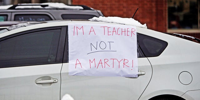 Supporters of the Chicago Teachers Union participate in a car caravan, as negotiations with Chicago Public Schools continue over a coronavirus disease (COVID-19) safety plan agreement in Chicago, Illinois, U.S., January 30, 2021. REUTERS/Eileen T. Meslar