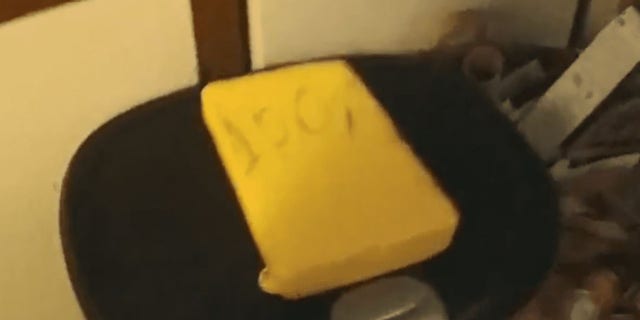The suspicious package containing a kilo of cocaine was encased in yellow rubber with "100%" written on the outside, police said.