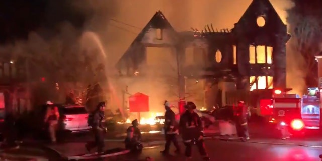 Firefighters continue to throw water on the remains of the original fire building. (D.C. Fire and EMS)