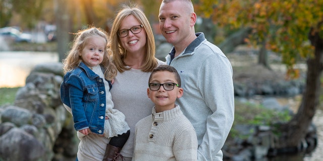 Kennedy Dorfman, left, her mother Aly, father Eric and older brother Cody