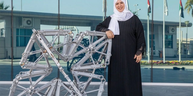 Etihad Airways has partnered with two artists to upcycle old plane parts into art installations at the airline's Abu Dhabi headquarters. Azza Al Qubaisi is pictured with her sculpture.