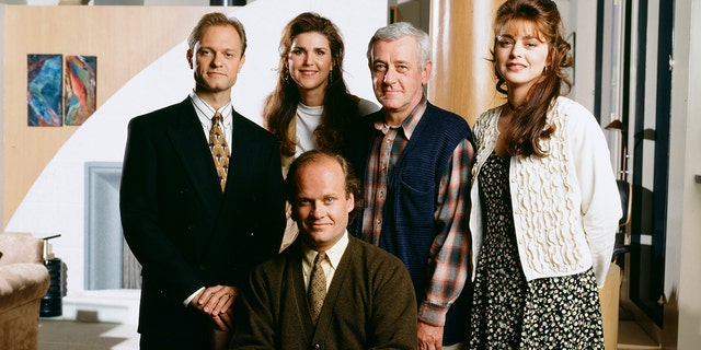 'Frasier' -- Pictured: (Back, l-r) David Hyde Pierce as Doctor Niles Crane, Peri Gilpin as Roz Doyle, John Mahoney as Martin Crane, Jane Leeves as Daphne Moon, (Front, seated) Kelsey Grammer as Doctor Frasier Crane
