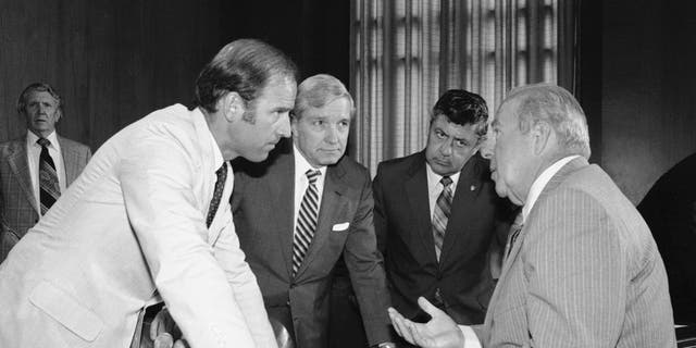 On this July 13, 1982, a file photo, Secretary of State designate George Shultz, right, speaks with members of the Senate Foreign Relations Committee before the start of the afternoon panel session on Capitol Hill in Washington.  From the left.  Sen.  Joseph Biden, D-Del .;  Senator Charles Percy, R-Ill., Chairman of the panel and Senator Edward Zorinsky, D-Neb.