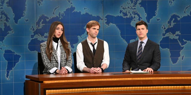 Pictured here is Heidi Gardner as Janet Noonan and Mikey Day as Lowell Fitzroy with anchor Colin Jost during "Saturday Night Live's" Weekend Update on Feb. 6. (Will Heath/NBC/NBCU Photo Bank via Getty Images/)