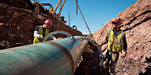 Workers in Oklahoma work on the Keystone XL pipeline project in 2013.