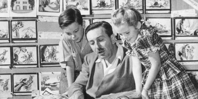 American film director, animator, and businessman Walt Disney with Bobby Driscoll and Luana Patten in 1946.