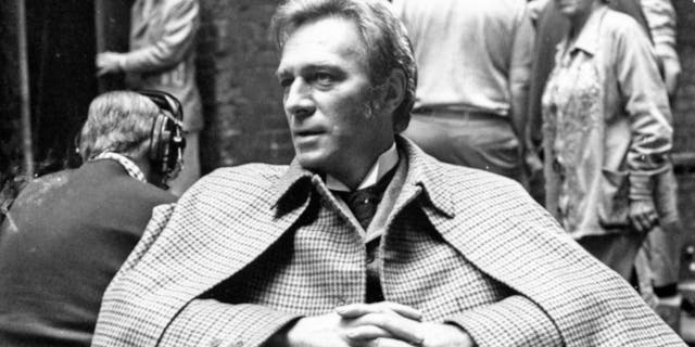 Christopher Plummer wearing his "Sherlock Holmes" costume as he relaxes during a break in filming "Murder by Decree" in Clint Street, London, July 29, 1978.