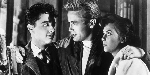 American actors Sal Mineo (1939 - 1976), James Dean (1931 - 1955) and Natalie Wood (1938 - 1981) in a still from director Nicholas Ray's film 'Rebel Without a Cause'.