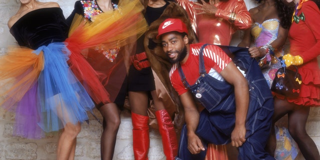 Paris-based American designer Patrick Kelly poses with his models in Paris in 1987.