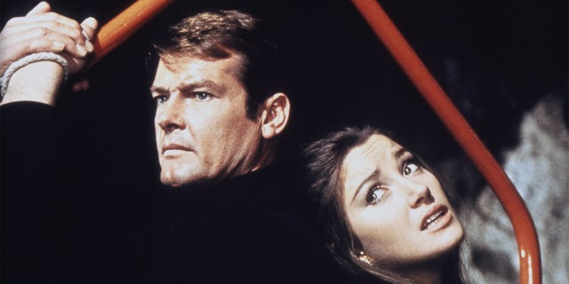 Actor Roger Moore and actress Jane Seymour on the set of 'Live And Let Die.'