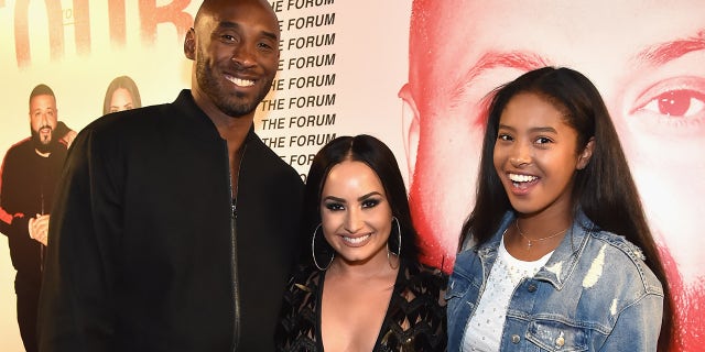 Kobe Bryant, Demi Lovato (center), and Natalia Diamante Bryant attend the 'Tell Me You Love Me' World Tour at The Forum on March 2, 2018, in Inglewood, California. Natalia, now 18, has signed with renowned agency IMG Models.