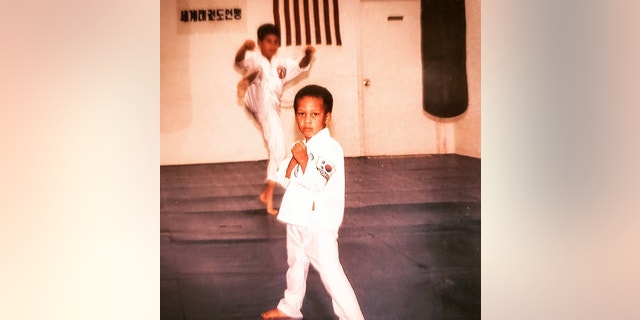 Nicholas Irving poses in martial arts class as child. (Nicholas Irving)