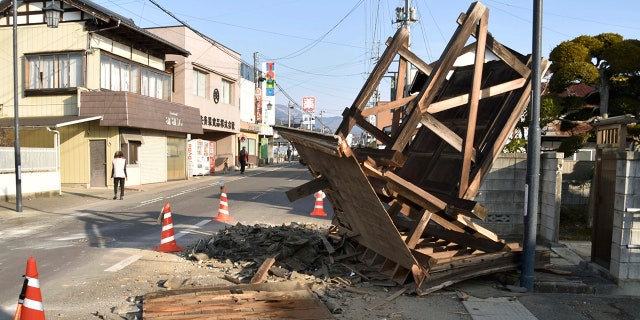 This photo shows a damaged entrance of a house in Kori town, north of Fukushima city, northeastern Japan, Sunday, Feb. 14, 2021, following an earthquake Saturday. (Associated Press)