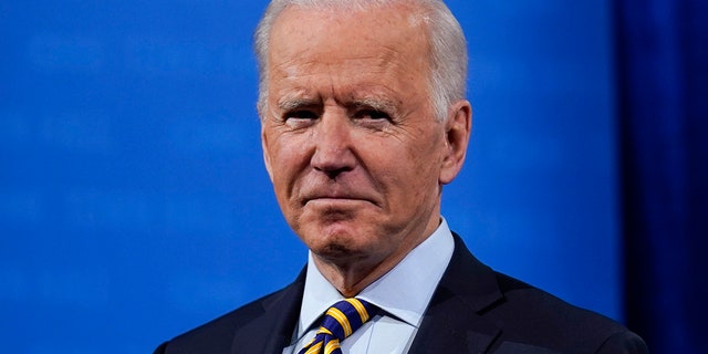 President Joe Biden stands on stage during a break in a televised town hall event at Pabst Theater, Tuesday, Feb. 16, 2021, in Milwaukee. (AP Photo/Evan Vucci)