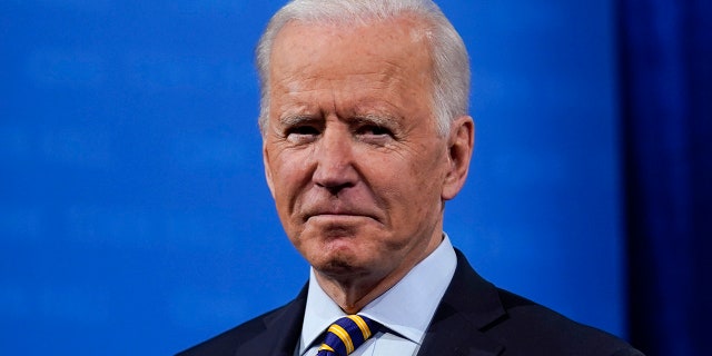 President Joe Biden stands on stage during a break in a televised town hall event at Pabst Theater, Tuesday, Feb. 16, 2021, in Milwaukee. (AP Photo/Evan Vucci)