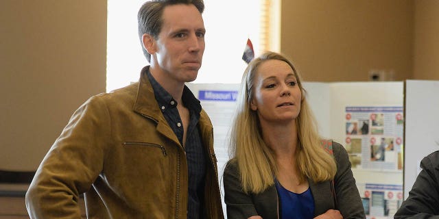 COLUMBIA, MO - NOVEMBER 06: Missouri's Republican U.S. Senate Candidate Josh Hawley waits in line with his wife, Erin Hawley, to casts their votes on election day at The Crossings Church on November 6, 2018 in Columbia, Missouri. Hawley, the current Missouri Attorney General, is hoping to unseat current Democratic incumbent Senator Claire McCaskill. (Photo by Michael Thomas/Getty Images)