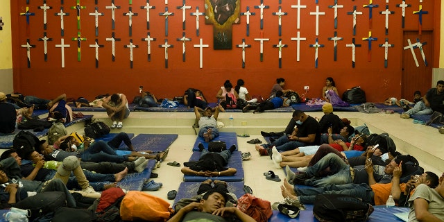 Central American migrants rest at "The 72" shelter in Tenosique, Tabasco state, Mexico, Tuesday, Feb. 9, 2021. Only six weeks into the year, the shelter has hosted nearly 1,500 migrants compared to 3,000 all of last year, even though it has halved its dormitory capacity due to the new cornavirus pandemic. (AP Photo/Isabel Mateos)